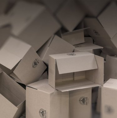 How should cardboard be prepared for recycling?